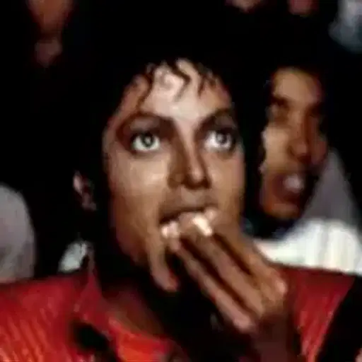 Figurinha: Michael Jackson comendo pipoca