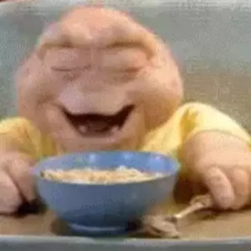 Figurinha: Bebê feliz comendo cereal