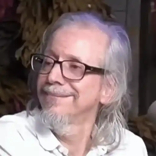 Figurinha: Homem com cabelo roxo e óculos